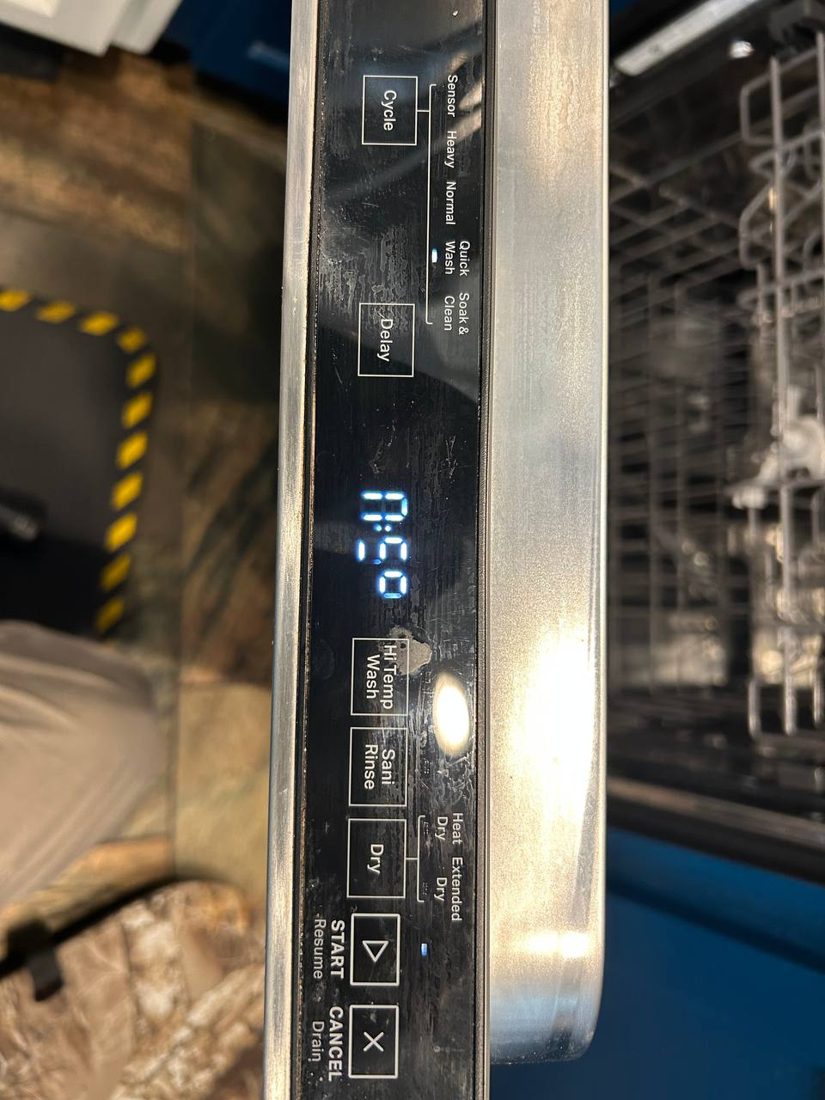 Control panel diagnostic readout glowing during a service call